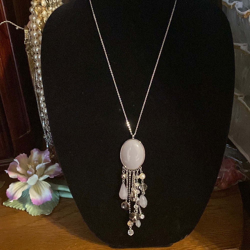 Whimsical dangle pendant with silver accents and silver chain.